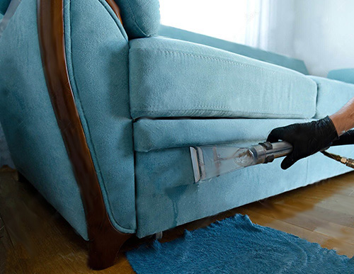 Blue upholstery fabric sofa being cleaning